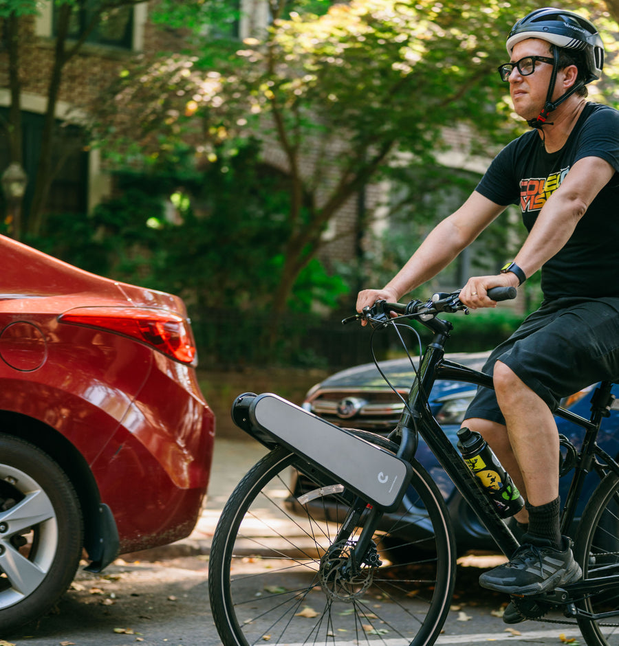 Jonah riding his CLIP bike down a Brooklyn street