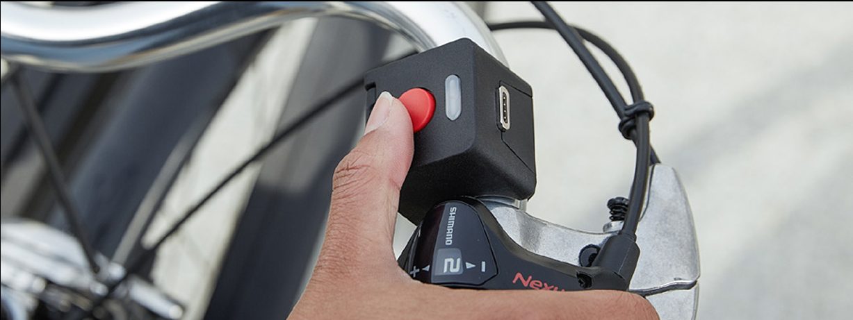 The CLIP remote on a handlebar, with the white Regen button below Boost